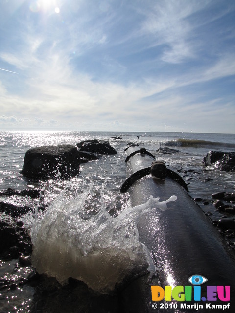 SX12635 Exposed drain pipe in low tide Ogmore by sea